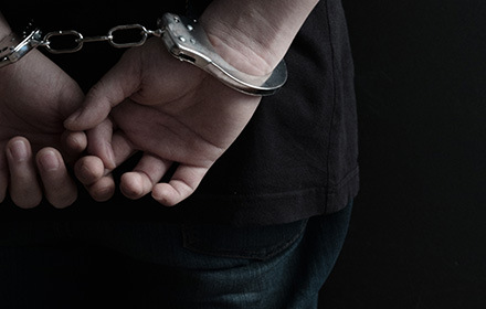 Close-up of Man in Handcuffs After Sexual Battery Charges