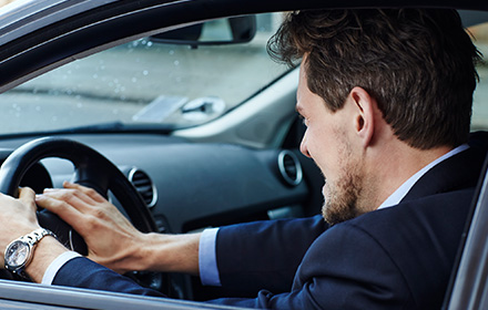 Business Men Honking His Car's Horn in Rising Road Rage