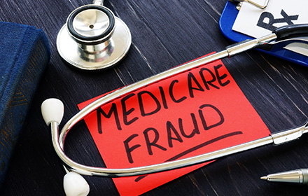 Stethoscope and Red Post-it Note With the Words Medicare Fraud