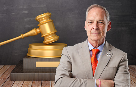 Lawyer Larry McMillan and Gavel in the Background Representing the Jury's Ruling