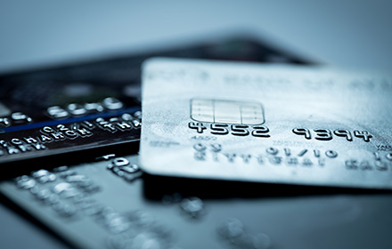 Close-Up of Credit Cards as Suburban Mother Faces Multiple Fraud and Counterfeit Charges