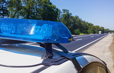 Picture of a Police Pulling Over a Car for Suspected Drug Crime Charges in Miami