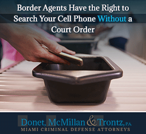 Can a Border Agent Legally Search Your Phone? Learn More from Miami Criminal Defense Lawyers Picture of Customs Checking a Cell Phone