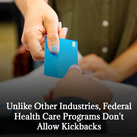 Person Offering a Gifcards Representing the Allocation of Kickbacks Among Medicaid Recipients