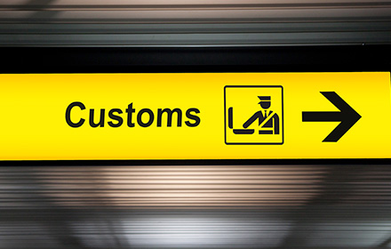 Yellow Airport Banner Signaling the Location of the Customs Declarations Area
