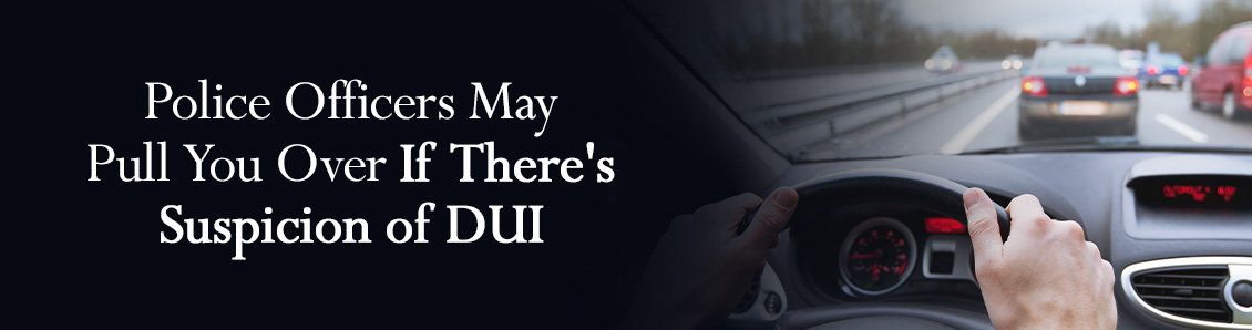 Hands Holding a Car's Steering Wheel To Simbolize the Risks of a DUI Offense