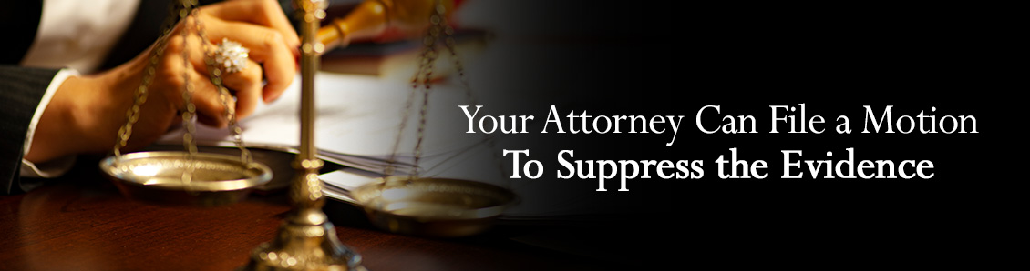 Scales of Justice While Attorney Looks Through Evidence With a Magnifying Glass