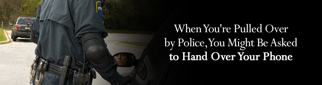 Police Officer Leaning Toward Car Window With the Driver Seen from Review Mirror