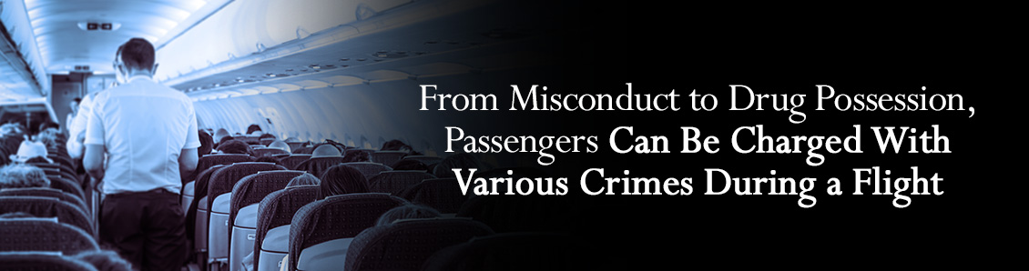 Staff Member in Airpline Aisle Addressing Passenger Misconduct 