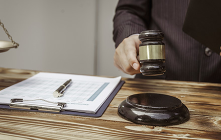 Close-Up of Gavel and Documents as Judge Approves and Injunction for Protection