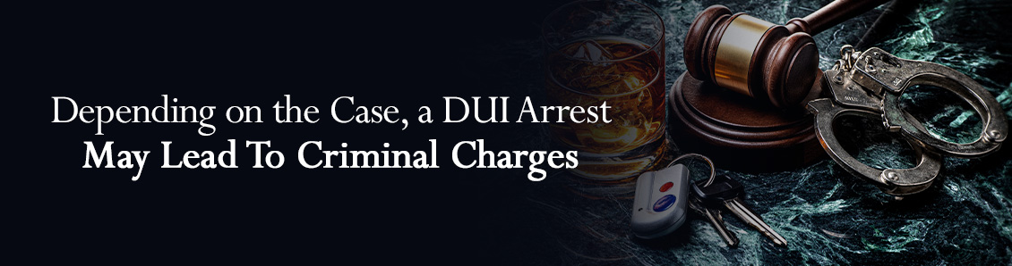 Handcuffs and Judge Gavel Next To Glass of Whisky To Represent the Legal Consequences of a DUI Charge