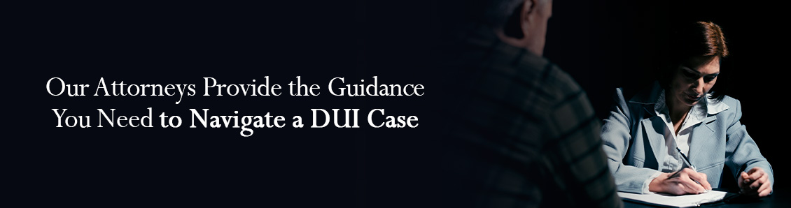 Defense Lawyer Facing Defendant and Taking Notes for DUI Case