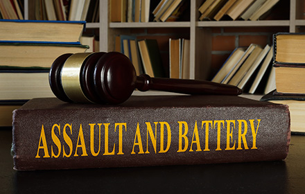 Judge Gavel on Top of Law Book on Assault and Battery