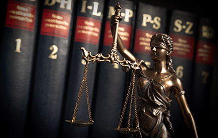 Scales of Justice and Law Books To Represent Our Attorneys' Legal Expertise