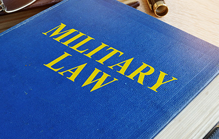 Military Law Book Representing the Differences Between Court Martial and a Military Trial