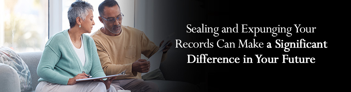 Middle-Aged Couple Looking at Documents During the Sealing and Expungement of Records