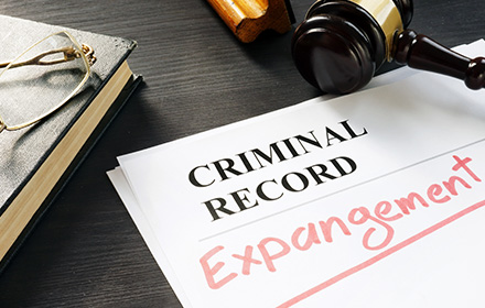 Documents Labeled as Criminal Records With the Word Expungement Written Over With a Red Marker