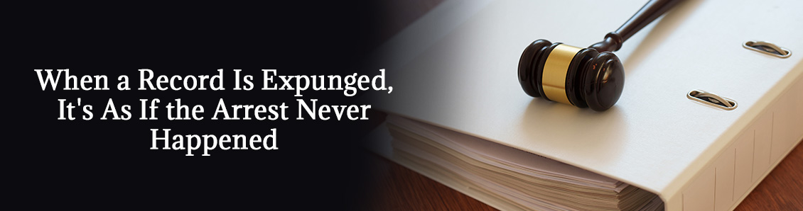 Judge Gavel Sitting on Top of a Large Binder Representing a Person's Criminal Record