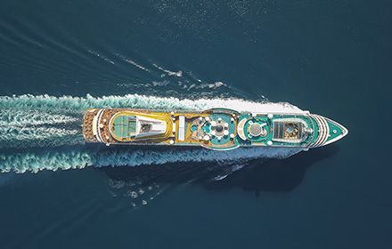 Bird's-Eye View of Cruise Ship Travelling Across the Ocean