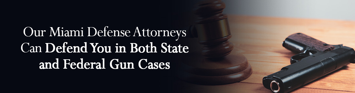 Firearm Next to Judge Gavel To Represent the Severity of a Criminal Charge