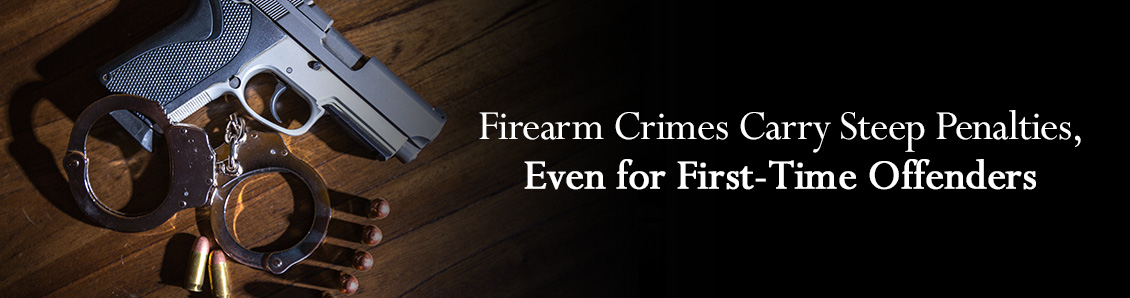 Firearm and Bullets Next To Handcuffs To Represent the Legal Penalties of Firearm Crimes