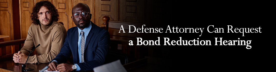 Defense Attorney Sitting Next to Defendant During Bond Hearing