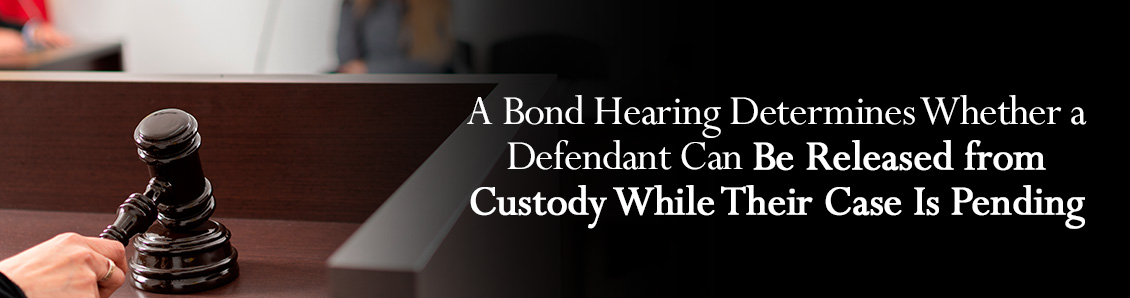 Judge's Hand Passing Sentence with a Gavel at Court During a Bond Hearing