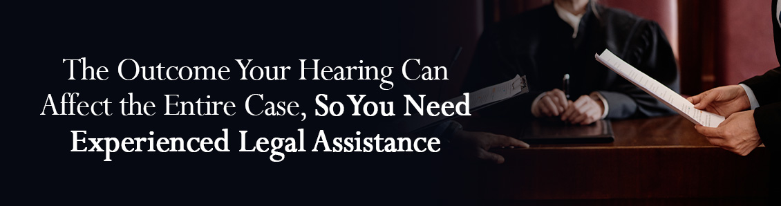 Judge Sitting Between Two Attorneys As They Look Over Case Documents 