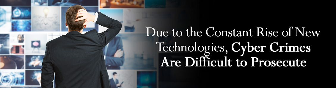 Backside of Man Looking at Various Digital Screens to Represent All the Techonologies Involved in Cyber Crimes