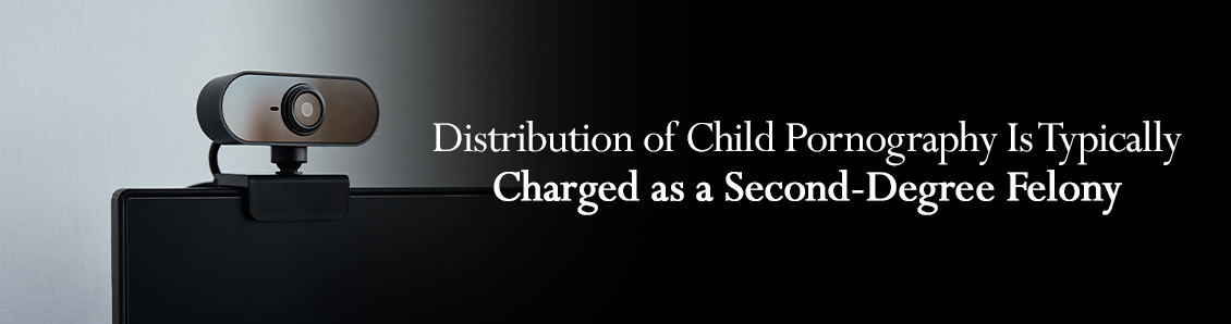 Web Cam on Top of Laptop To Represent the Crime of Distribution of Child Pornography