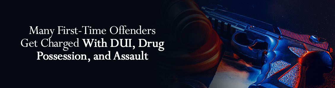 Gun and Judge Gavel Representing the Most Common Charges for First-Time Offenders