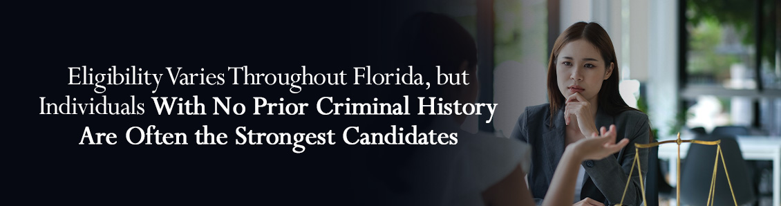 Attorney and Defendant Sitting on Desk and Discussing Eligibility to Florida Pre-Trial Programs