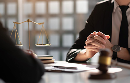 awyer's Hands on Top of Desk While Facing Judge Gavel During a Misdemeanor Case