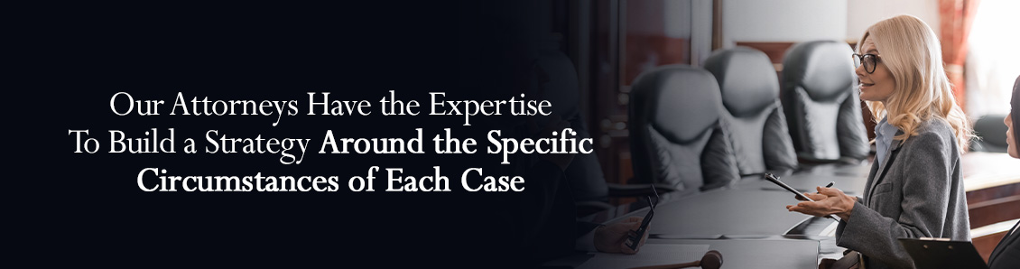 Female Lawyer Sitting in Front of Desk and Discussing the Defense Strategy of a Criminal Case