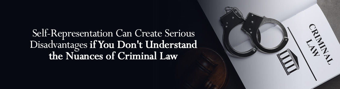 Open Book Titled 'Criminal Law' Resting Under Pair of Handcuffs