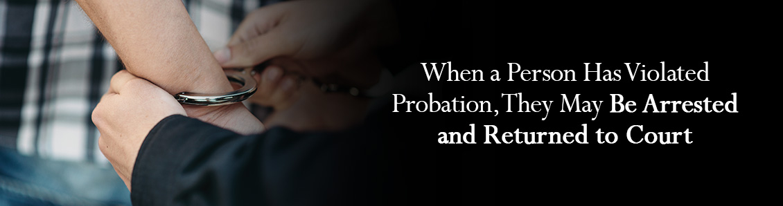 Man Being Handcuffed By Police Officer After Violating His Probation